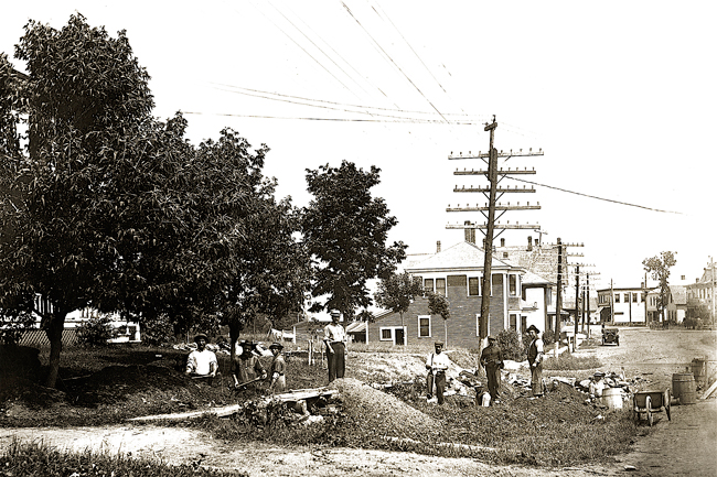 Men digging ditch